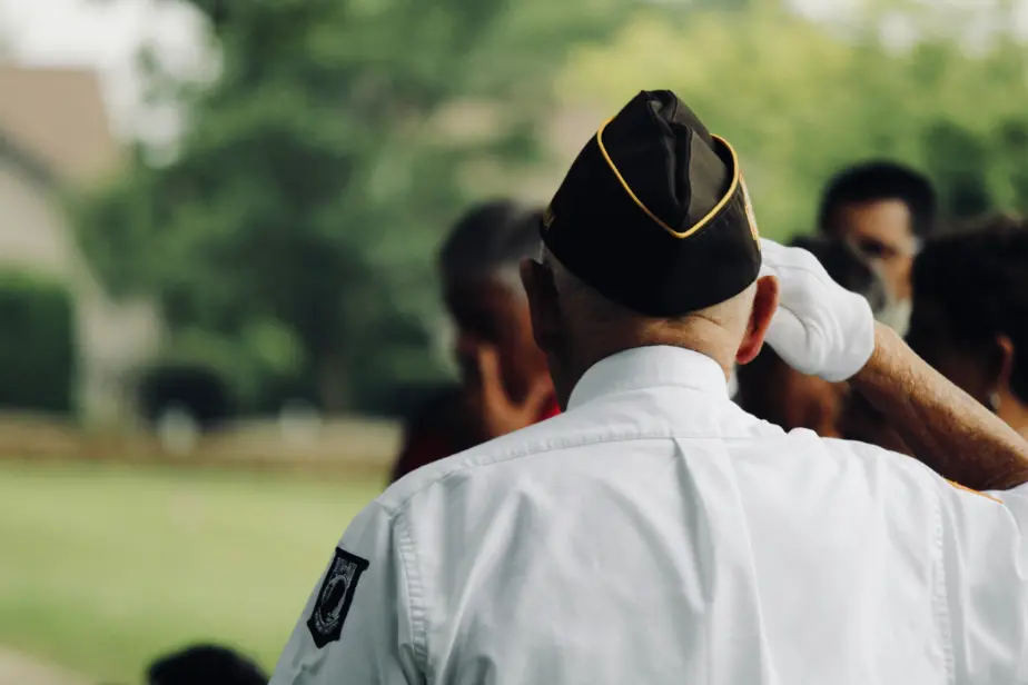 back of a veteran saluting